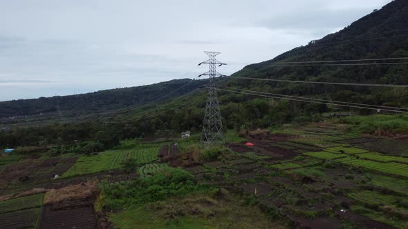 The drone's backward aerial motion captures the path of electricity in cloudy weather