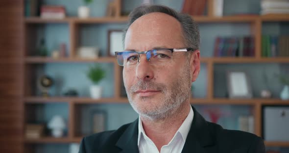 Bearded Adult Businessman in Glasses Looking Away and then Turning His Head Into Camera