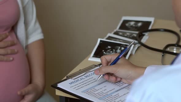 Pregnant Woman and Gynecologist Doctor at Hospital