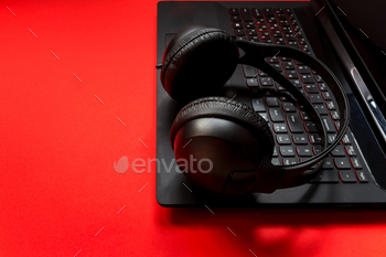 Game keyboard, headphones, mouse accessories for a gamer on a red background. flat lay top view with / Photodune, Misc