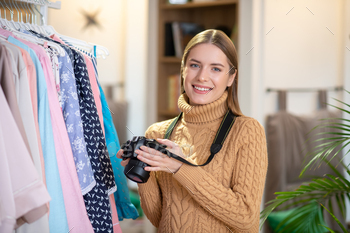 Young smiling woman taking pictures of clothes / Photodune, Misc