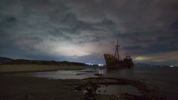 Dark atmospheric moody time lapse of a apocalyptic ship wreck Dimitrios during night with clouds mov