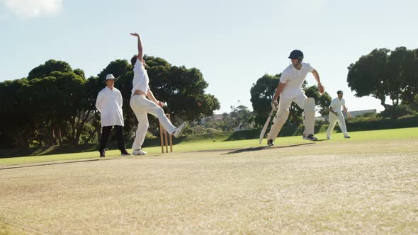 Bowler delivering ball during cricket match