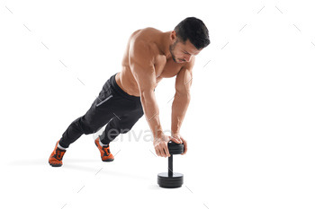 Muscular man doing push ups using dumbbell / Photodune, Misc