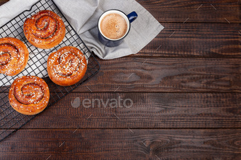 cup of coffee or cappuccino, on a wooden background, horizontal, top view, copy space
