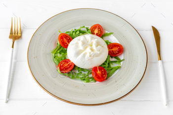 Salad with burrata cheese and cherry tomatoes on white wooden background / Photodune, Misc