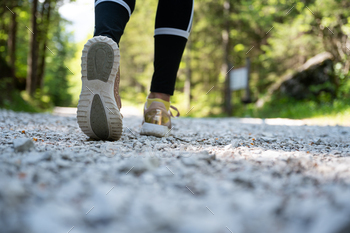 Low angle view of female feet hiking / Photodune, Misc