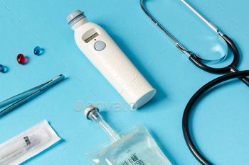 A close-up view of a medical instruments lying on a blue background / Photodune, Misc