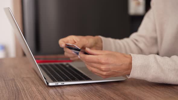 Upset Young Woman Using Online Banking Service Problem with Blocked Credit Card Using Laptop