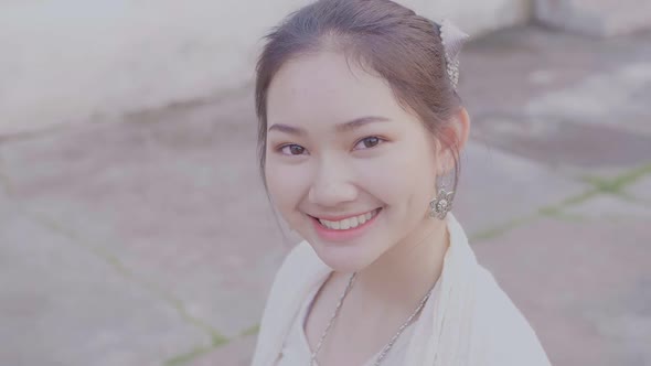 Beautiful Asian Girl In Lao Traditional Costume Smiling And Looking At Camera