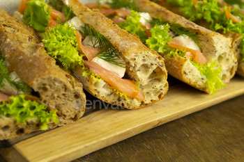 Baguette sandwiches with salmon and lettuce, close up / Photodune, Misc