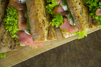 Baguette sandwiches with salmon and lettuce, top view / Photodune, Misc