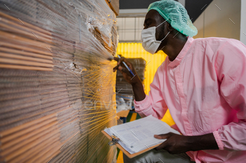 African American inspection worker engineer are work in drink water manufacturing factory / Photodune, Misc