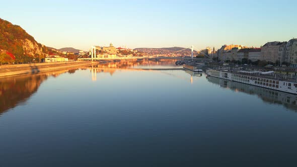 The sun illuminates Elisabeth Bridge and the hills of Budapest