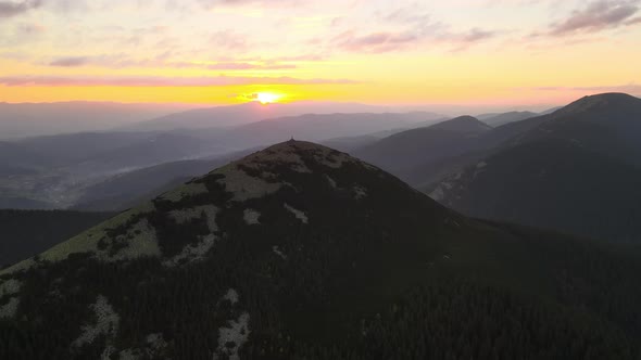 Aerial View of Amazing Scenery with Foggy Dark Mountain Peak Covered with Forest Pine Trees at