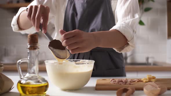 The Process Of Baking, A Woman In An Apron Prepares Breakfast In The Kitchen For A Family, A Family