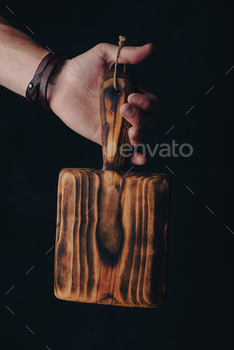 Handcrafted Cutting Board in Hand / Photodune, Misc