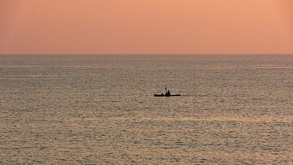 Kayak Floating In The Sea At Dawn