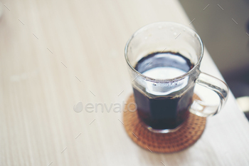 black hot coffee on table in the cafe / Photodune, Misc