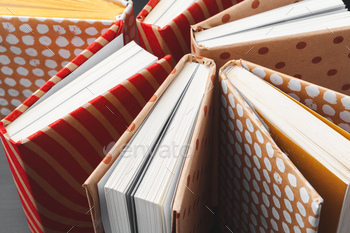 paperback books on a table / Photodune, Misc