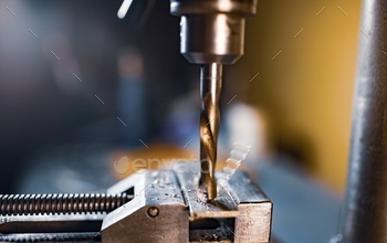 Drilling process with shavings close-up at the workplace in workshop / Photodune, Misc