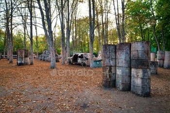 Lots of old round barrels in the paintball base / Photodune, Misc