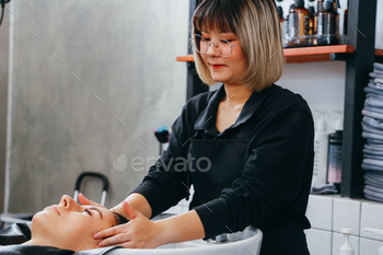 Hairdresser shampooing hair of female customer / Photodune, Misc