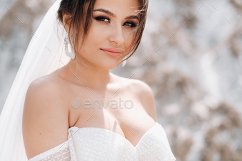 Beautiful bride in a wedding dress with a bouquet on the top of the salt mountains. A stunning young / Photodune, Misc