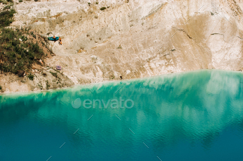 Vaukavysk chalk pits or Belarusian Maldives are beautiful saturated blue lakes.Two tourists pull a / Photodune, Misc