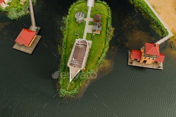view from the height of the Lake in a green field in the form of a horseshoe and a village in the / Photodune, Misc