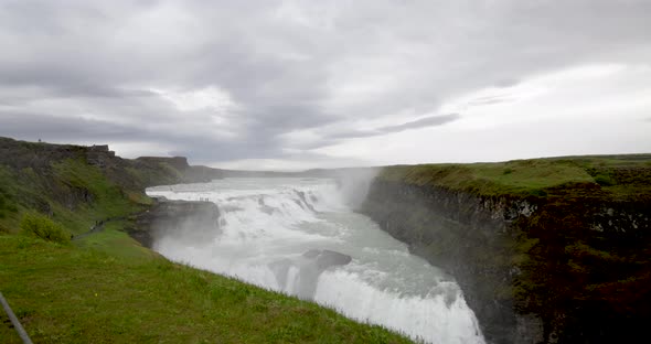 Gulfoss waterfalls in Iceland with gimbal video walking on path in slow motion.