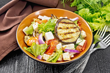 Salad of eggplant with feta and tomatoes on board / Photodune, Misc