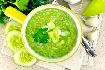 Soup cucumber in yellow bowl on granite table top / Photodune, Misc