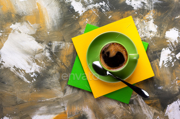 Cup of coffee and spoon at colorful abstract background texture. Coffee break time / Photodune, Misc