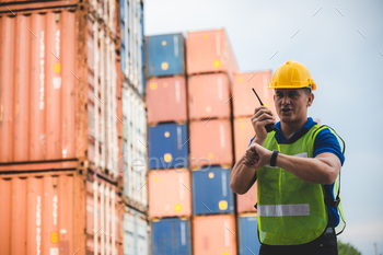 engineer foreman working in container cargo logistic shipping industry for import and export / Photodune, Misc
