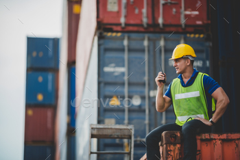 engineer foreman working in container cargo logistic shipping industry for import and export / Photodune, Misc