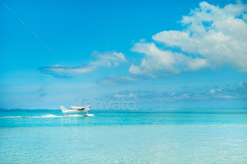Seaplane begins to take off on the island of Mauritius in the Indian Ocean / Photodune, Misc