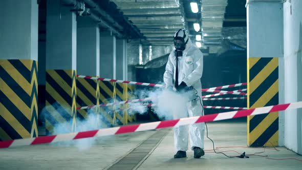 A Sanitation Worker Disinfects Room. Coronavirus Prevention, Covid-19 Protective Disinfection