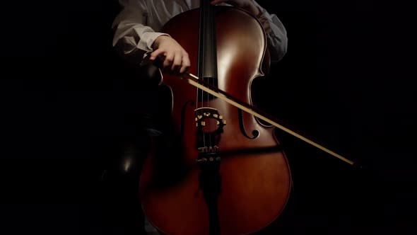 In Studio a Woman Plays the Cello