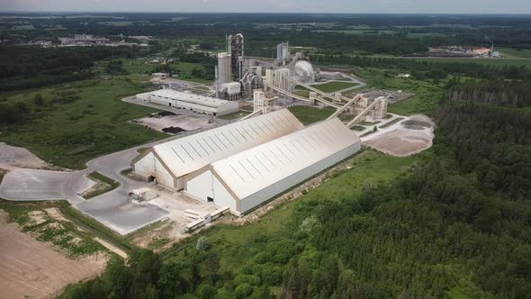 Concrete industrial factory in the middle of the wood