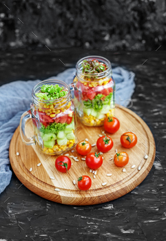 Salad with tomatoes and corn and cucumbers and lettuce. Healthy / Photodune, Misc