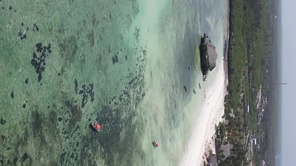 Vertical Video of the Ocean Near the Coast of Zanzibar Tanzania Aerial View