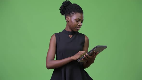 Young Beautiful African Businesswoman Using Digital Tablet