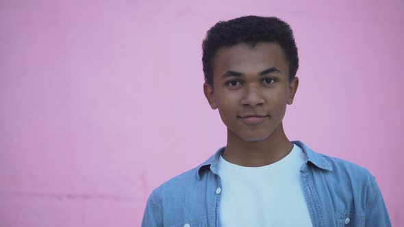 Confident African-American Teenager Smiling to Camera Adjusting Hair, Puberty