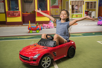 child having fun in playroom. Kids leisure, fun and positive emotions.