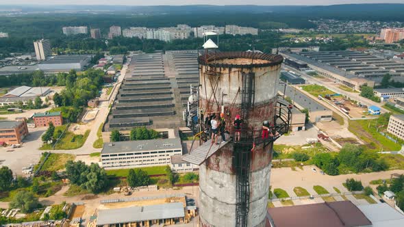 Aerial View Man Jumps From an Extremely High Height Upside Down