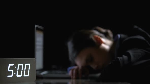 Sleepy Lady in Suit Switching Off Alarm, Lying on Laptop in Office Late at Night