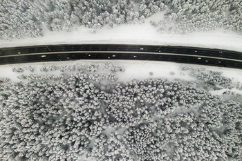 View from the height of the winter forest with snow-covered trees in winter and a forest road with / Photodune, Misc