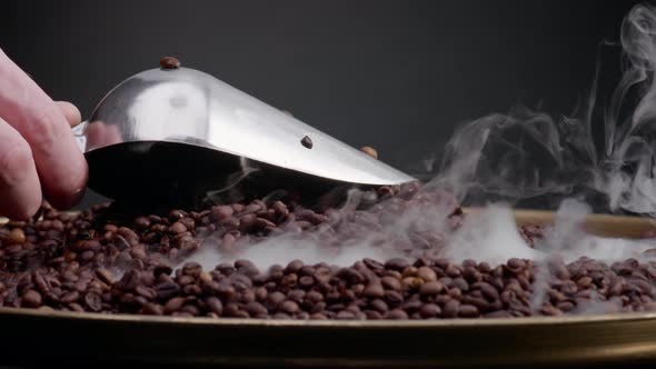 Roasted Coffee Seeds Scooping Using Ladle Closeup