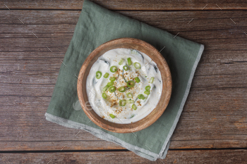Traditional Indian Raita with Dahi in a bowl on a wooden background / Photodune, Misc